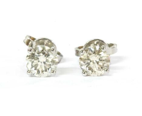 A pair of white gold single stone diamond stud earrings, with a brilliant cut diamond, with a stated total weight of 1.13ct, 