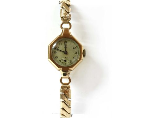 A ladies' 9ct gold Tudor mechanical bracelet watch, an octagonal case, 21mm diameter, with a silvered dial, Arabic numerals, 