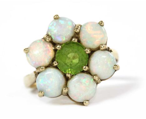 A 9ct gold peridot and opal cluster ring, with a round mixed cut peridot, to surround of round opals, all claw set, to open t