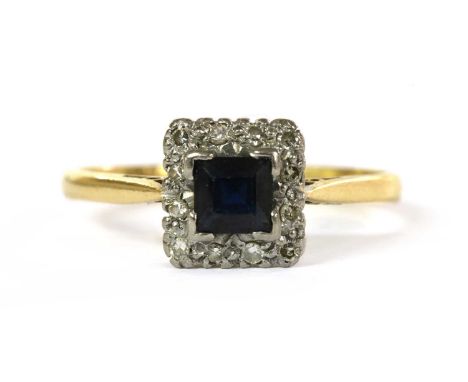 A gold sapphire and diamond cluster ring, with a square step cut sapphire, claw set, to surround of eight cut diamonds, grain