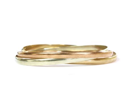 A 9ct three colour gold bangle, with interlinking 'D' section rose, yellow and white gold bangles, Sheffield 1993, internal d