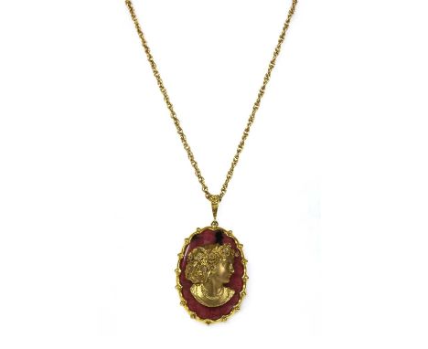 A 9ct gold diamond and rhodonite composite cameo pendant, a gold profile of a lady with eight cut diamonds spitch set to her 