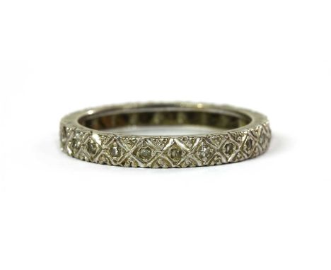 A white gold diamond full set eternity ring, with eight cut diamonds grain set to lozenge collets, tested as approximately 18