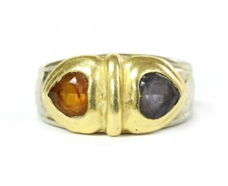 An Italian two colour gold citrine and iolite ring, with a heart shaped citrine and iolite, rub set in yellow gold, to white 