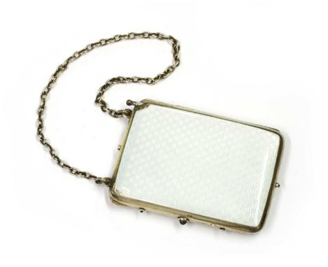 A silver gilt and enamel, sapphire set evening purse, with white enamelled covers, trace chain handle and sapphire set thumbp