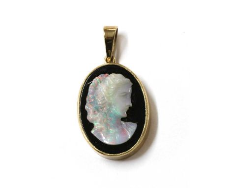 A gold mounted opal and onyx composite cameo pendant, with a carved opal profile of a lady, applied to an onyx tablet, specta