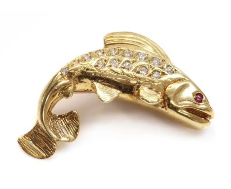 An 18ct gold diamond and ruby fish brooch, with a modelled leaping fish, pavé set with graduated brilliant cut diamonds, with