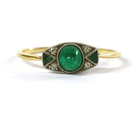 An Art Deco emerald and diamond ring, with a high cabochon emerald, with a pair of eight cut diamonds and a triangular step c