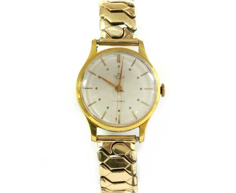 A gold plated Smiths 'De Luxe' mechanical bracelet watch, 32mm diameter with a silvered dial, baton hour markers and red arro