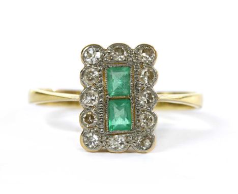 A gold emerald and diamond cluster ring, with two rectangular step cut emeralds, to surround of eight cut diamonds milligrain