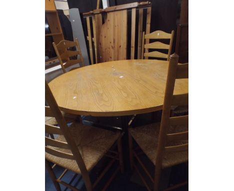 A Circular Chrome Based Dining Table with Six Ladder Back Chairs 