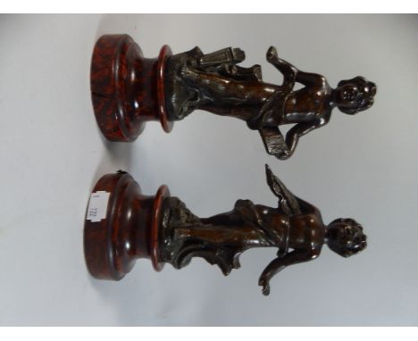 A Pair of French Bronzed Spelter Figures of Cherubs, Each 23cm high 