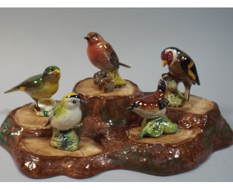 A Collection of Five Beswick Birds on Tree Trunk Stand 