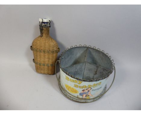 A Reproduction Busy Bubbles Circular Storage Tin and Wicker Covered Glass Flask