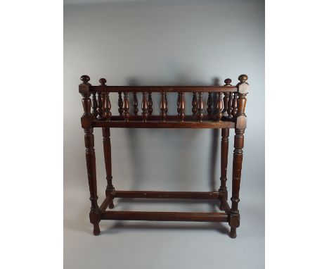 An Edwardian Mahogany Three Division Stick Stand with Turned Supports, Missing Base Tray, 71cm Wide