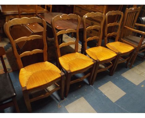 A Set of Four French Rush Seated Ladder Back Dining Chairs