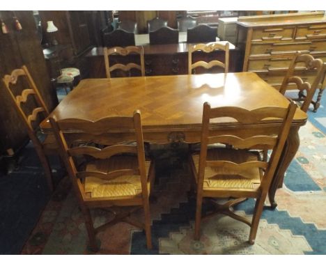 A French Oak Draw Leaf Dining Table with Six Ladder Back Chairs