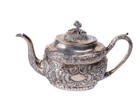 An attractive Irish Georgian period oval shaped silver Teapot, by Robert Breading, Dublin 1804, the hinged and domed lid with