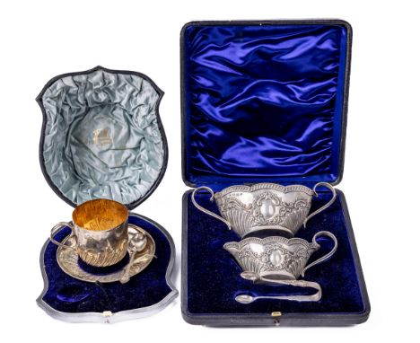 A cased English silver Christening Cup and Saucer, and Spoon, by E.H. (Wm. Hutton &amp; Sons) retailed by West &amp; Son; tog