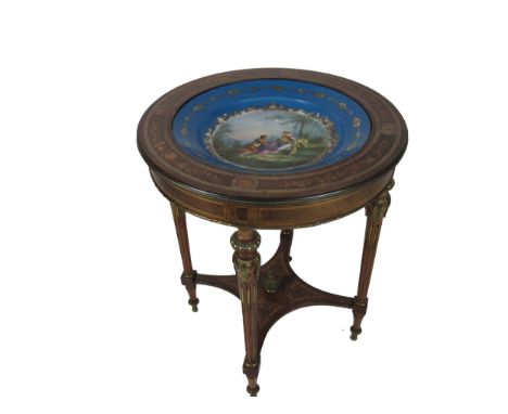 An attractive French Louis XVI style circular Table, the top inset with Sevres type decorated bowl with pastoral scene with f