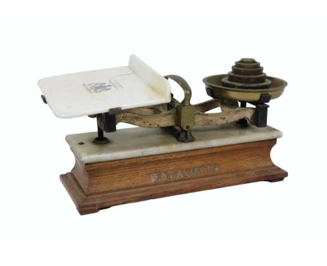 An Edwardian W. &amp; T. Avery Weighing Scales, with weights, porcelain balance on an oak base. (1) 