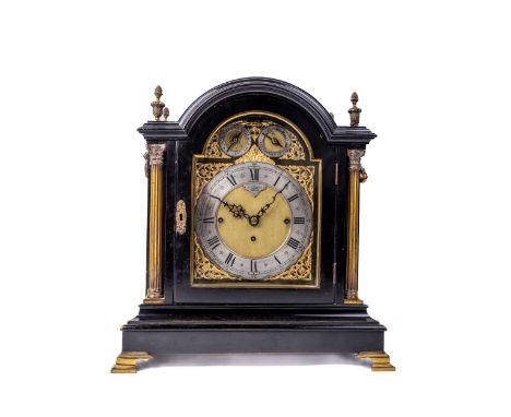 A fine quality Victorian ebonised chiming Bracket Clock, the arched top with ornate brass acorn topped brass finials, the gla