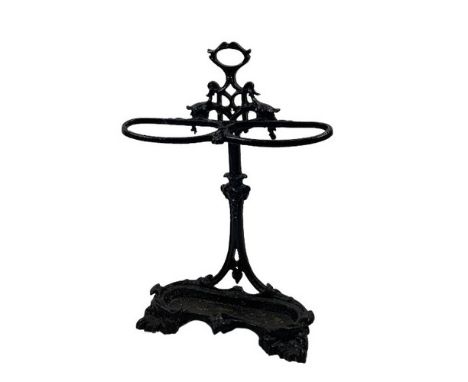 A Victorian cast iron Coalbrookdale Stick and Umbrella Stand, with carrying handle, above two holders on basin base, approx. 