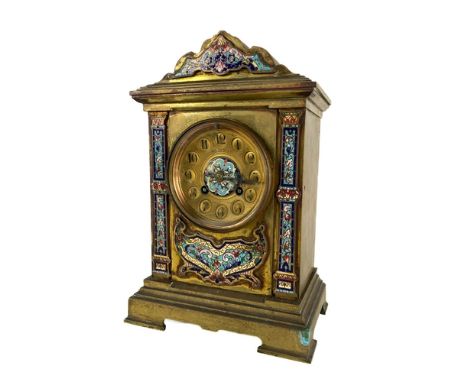 A 19th Century French brass Mantle Clock, with champlevé panels and cornice, the circular dial with Arabic numbers, and retai