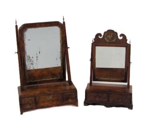 A fine quality early 19th Century walnut Dressing Table Mirror, the arched swing framed mirror with parcel gilt surround, on 