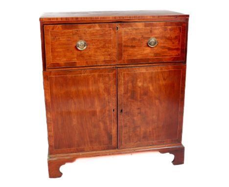 A Georgian mahogany pull-out Bureau, the plain top over first drawer opening to reveal fitted interior over a press base, on 