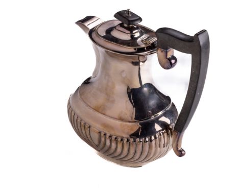 An English Georgian style Sheffield silver Coffee Pot, of bulbous form with ebonised handle and finial, by Edward Viner, c. 1