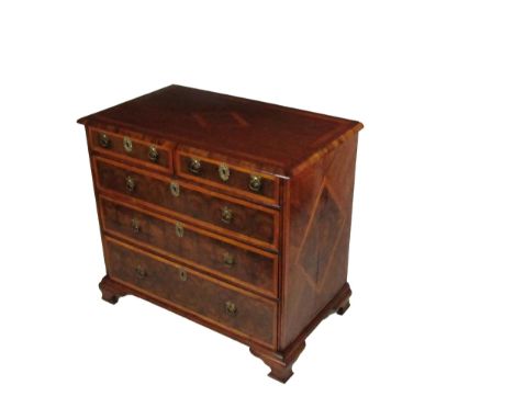 An attractive 18th Century English walnut oyster veneer Chest of Drawers, the moulded top with crossbanding and central diamo