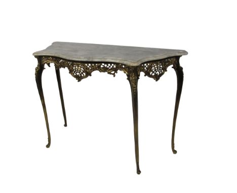 A French Louis XVI style Console Table, the moulded white marble serpentine top over a rococo decorated metal base with pierc