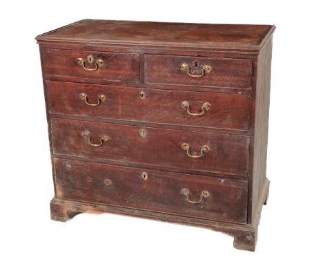 A Georgian Provincial oak Chest of Drawers, with tray top over two short and three long drawers with brass drop handles on br