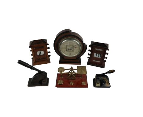 A late Victorian oak Desk Calendar, a similar modern ditto; an oak and brass Postage Scales, an Art Deco wooden Table Baromet