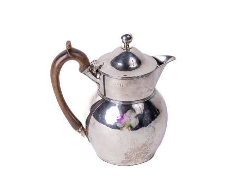 An Irish Georgian period silver Coffee Jug, of bulbous form, by James Scott, Dublin 1805, with wooden handle, the hinged dome