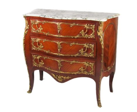 A French style kingswood bombe shaped Commode, the moulded marble top over three long drawers with ornate ormolu mounts and h