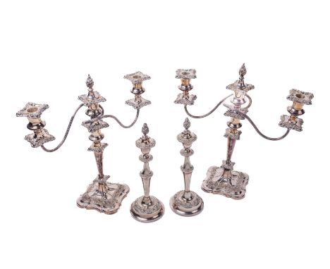 A pair of Victorian silver plated two branch three light Candelabra, of embossed design, with matching single light Candlesti
