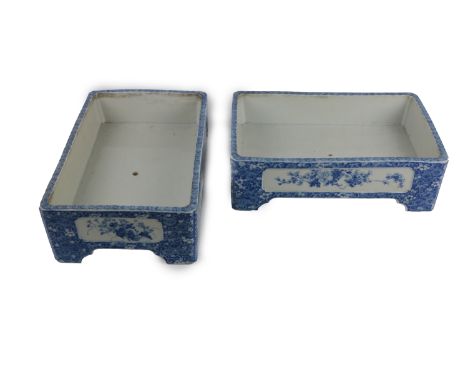 A large pair of attractive blue and white Japanese (Meiji period) rectangular Planters, decorated with floral panels on brack