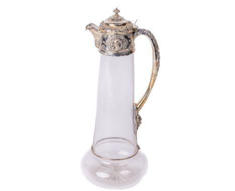 A Victorian silver mounted Claret Jug, of embossed classical design, maker C.E., London c. 1876, the hinged top with finial, 