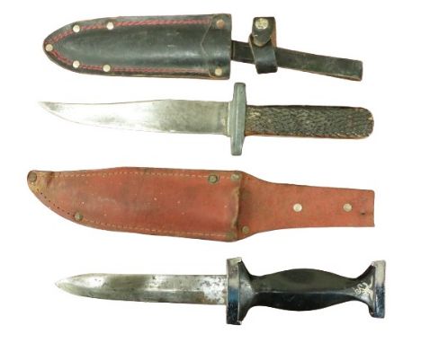 Militaria: A World War II Trench Dagger, with ebonised handle and leather scabbard with red thread, and inlaid motif of bird 