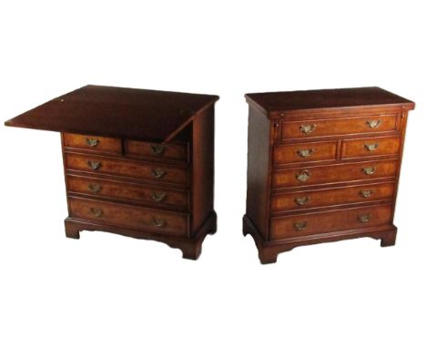 A pair of attractive Georgian style mahogany Bachelors Chests, each with inlaid and crossbanded fold-over tops, with long top
