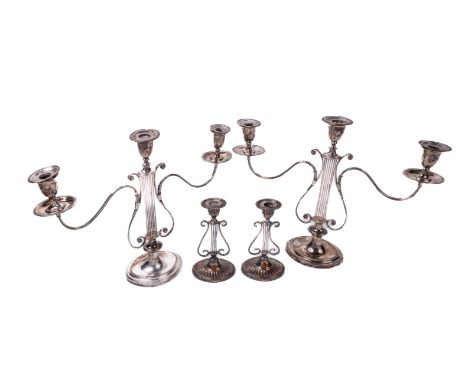 A pair of two branch lyre design three light Victorian silver plated Candlesticks, after George III style, c. 1890, with oval
