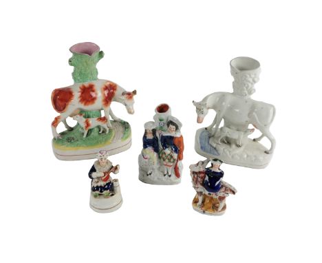 A collection of early Staffordshire porcelain Figures, comprising two large Vases, modelled as cow and calf; together with th