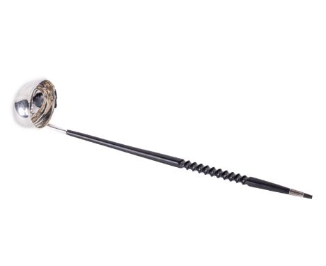 An Irish silver ebony handled Brandy Ladle, by William Egan, Dublin 1974, the oval shaped bowl issuing a spiral turned ebonis