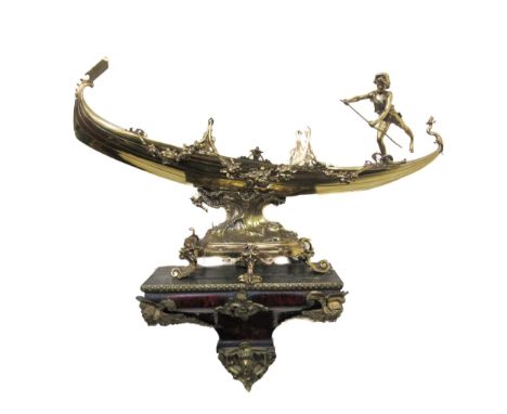 An attractive and ornate brass Model, of a Gondola and Gondolier, embellished with floral garlands on a stylized base with se
