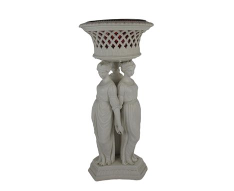 A large Copeland Parian ware figural Jardiniere, with pierced basket top and ruby glass liner supported by the "Three Graces,