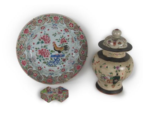 A 19th Century Chinese bulbous Urn and Cover, the domed top lid with shaped finial decorated with fruit, flowers etc., above 