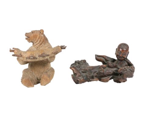 An original carved 'Black Forest' Pipe Holder, modelled as a seated bear; together with a Chinese root carving of a resting B