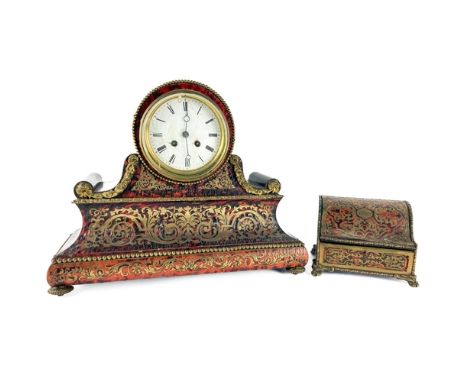 A 19th Century boulle Mantle Clock, the circular enamel dial with Roman numerals over a concave rectangular body profusely de